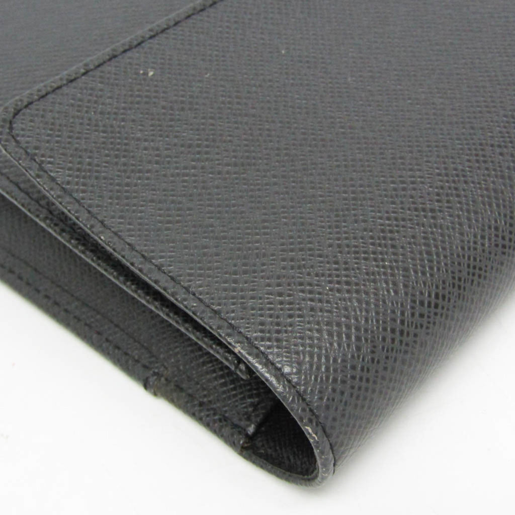 Louis Vuitton Taiga Selenga · Clutch