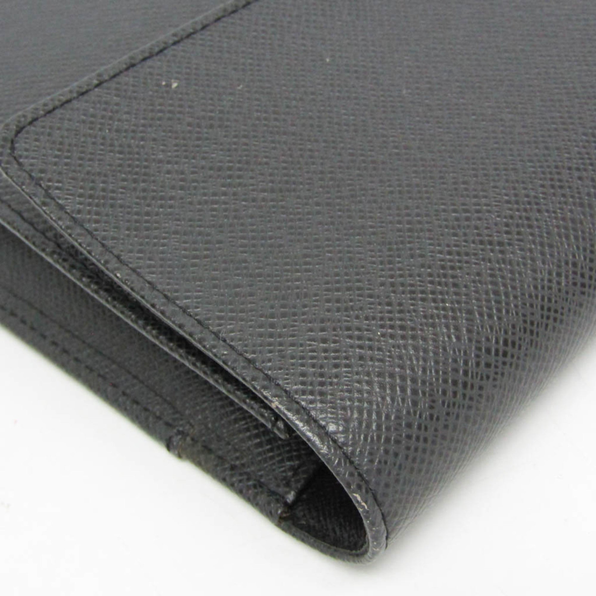 Louis Vuitton Taiga Selenga · Clutch