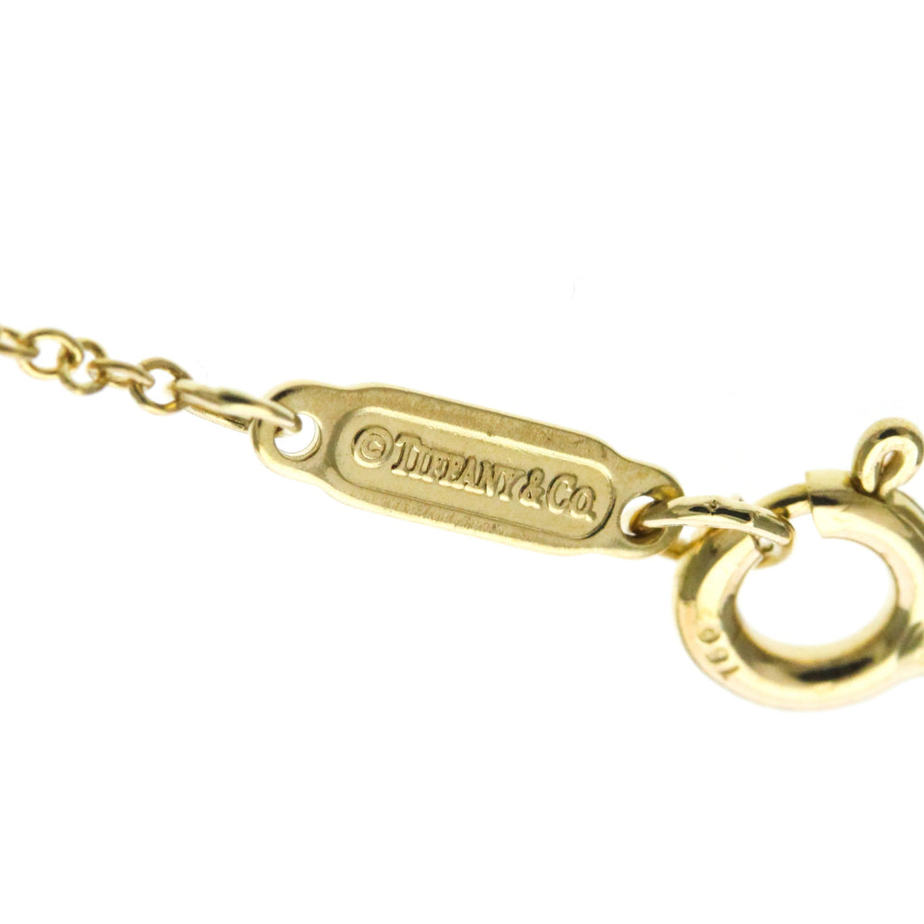 Tiffany Cross · 18K Yellow Gold · Diamond