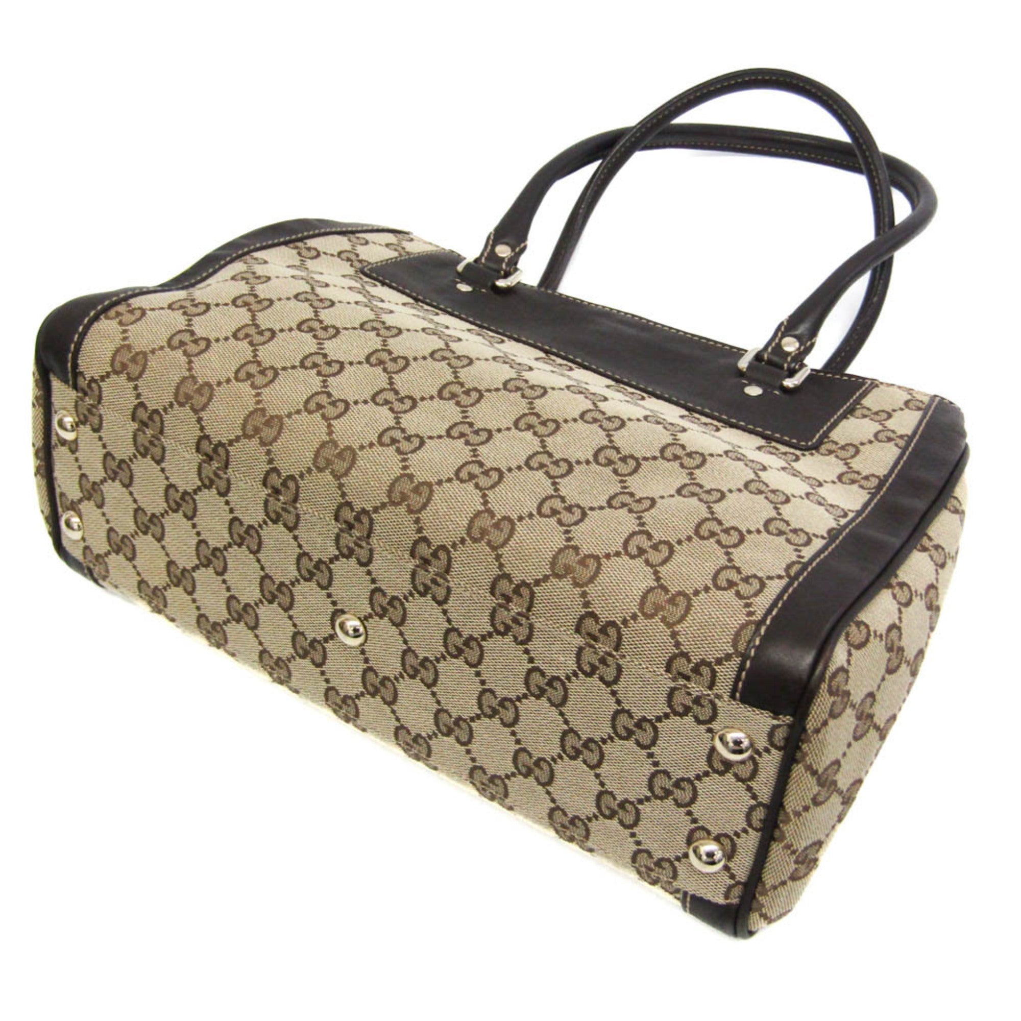 Gucci GG Canvas · Leather Handbag
